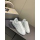 Angled pair view of Golden Goose Purestar white leather trainers on display