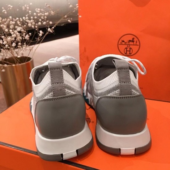 Rear view of both Hermes grey knit trainers showing the grey heel overlays