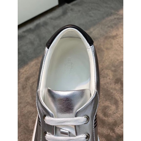 Hermes Avantage Metallic Silver Trainer Tongue and Interior Detail Top-down closeup of the padded collar, metallic silver tongue and white laces on the Hermes trainer