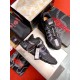 Versace Trigreca Black Trainers Packaging View Top-down view of Versace Trigreca black trainers next to luxury branded packaging and accessories