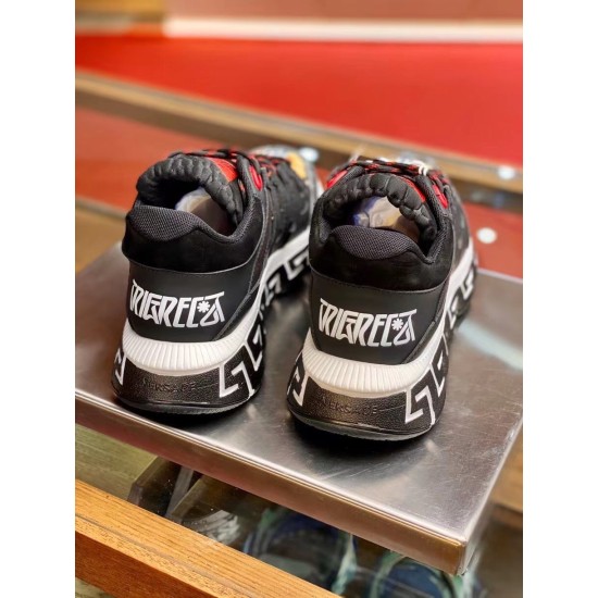 Versace Trigreca Black Trainers Rear View in black and yellow Rear view showing heel counters with white Trigreca text and thick rubber soles on black trainers in black and yellow