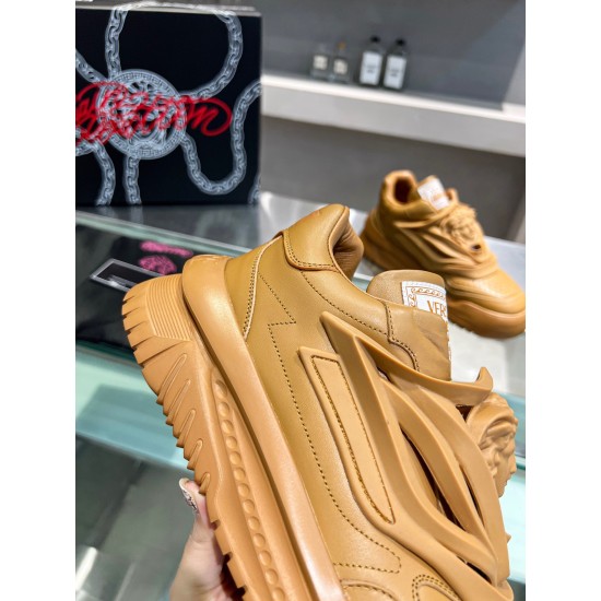 Close-up side profile of Versace Odissea brown trainer upper