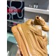 Close-up side profile of Versace Odissea brown trainer upper
