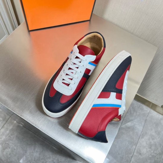 Top angled view of Hermes Boomerang trainers showing the white laces and side details in multicolour