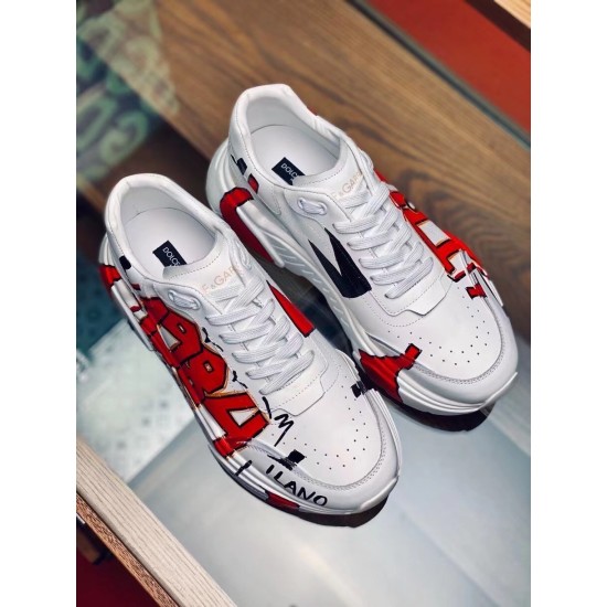 Dolce & Gabbana White Graffiti Trainers Top View Top-down view of Dolce & Gabbana white graffiti trainers on glass surface