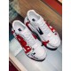 Dolce & Gabbana White Graffiti Trainers Top View Top-down view of Dolce & Gabbana white graffiti trainers on glass surface
