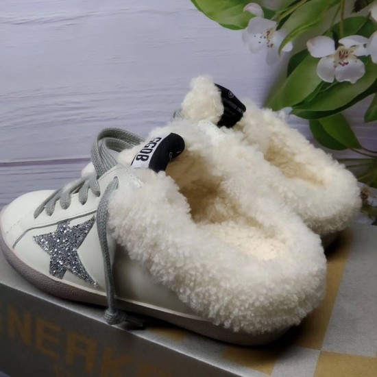 Golden Goose Super-Star Sabot Side View in white Golden Goose Super-Star Sabot white trainers side profile resting on shoe box