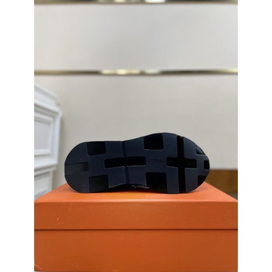 Hermes Drive Leather Low Top Trainers Black Outsole View in black and white Underside view of black rubber lugged sole on Hermes Drive Leather Low Top Trainers in black and white