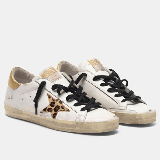 Golden Goose White Leather Trainers Front View Golden Goose Super-Star white leather trainers with leopard star patch and gold heel tab on white background