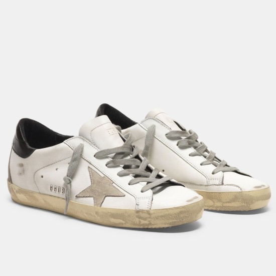 Golden Goose Super-Star White Leather Trainers - Front View in white and grey Pair of Golden Goose Super-Star white leather trainers with grey suede stars on a white background