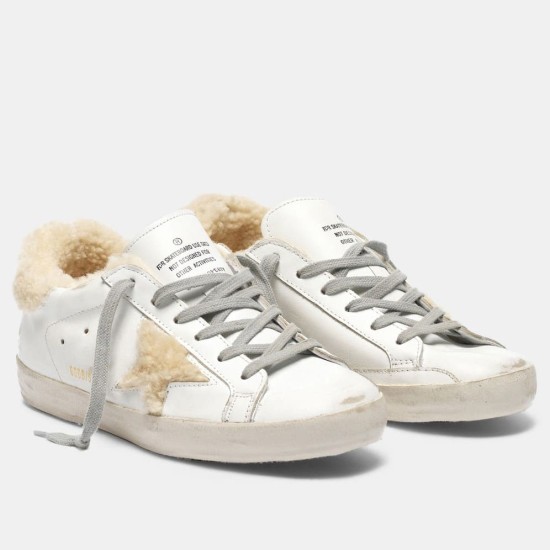 Golden Goose Super-Star Shearling White Trainers Front View in white and grey Front ¾ view of Golden Goose Super-Star shearling lined white leather trainers with grey laces
