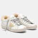 Golden Goose Super-Star Shearling White Trainers Front View in white and grey Front ¾ view of Golden Goose Super-Star shearling lined white leather trainers with grey laces