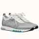 Pair of Hermes Addict grey knit low top trainers in a side profile view