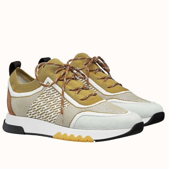Hermes Addict Knit Trainers Beige White Three-Quarter View Pair of Hermes Addict Knit Trainers in beige and white shown at a three-quarter angle