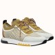 Hermes Addict Knit Trainers Beige White Three-Quarter View Pair of Hermes Addict Knit Trainers in beige and white shown at a three-quarter angle