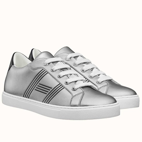 Hermes Avantage Metallic Silver Trainers Three-Quarter View Pair of Hermes Avantage metallic silver leather trainers shown at a three-quarter angle