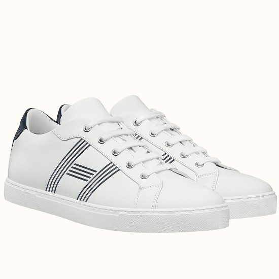 Hermes Avantage Leather Trainers Pair View in white and blue Pair of white and blue Hermes Avantage trainers angled on a white surface