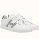 Hermes Avantage Leather Trainers Pair View in white and blue Pair of white and blue Hermes Avantage trainers angled on a white surface