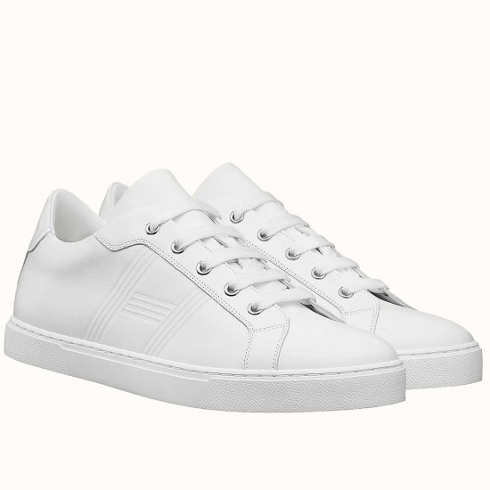 Hermes Avantage low top white leather trainers pair shown three-quarter angle