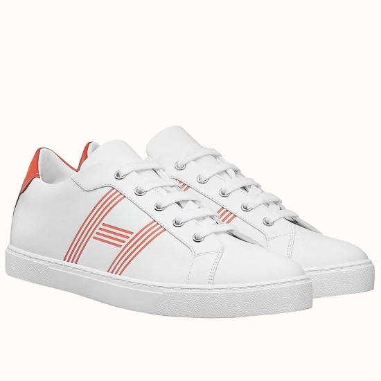 Front Angle View of White and Orange Leather Trainers Pair of white and orange leather low-top trainers displayed together at an angle