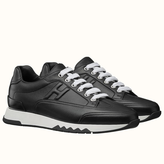 Hermes Trail low top black leather trainers pair angled view with white laces
