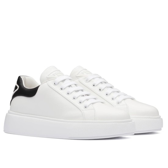 Side profile view of Prada Macro white leather low-top trainers with black heel accent