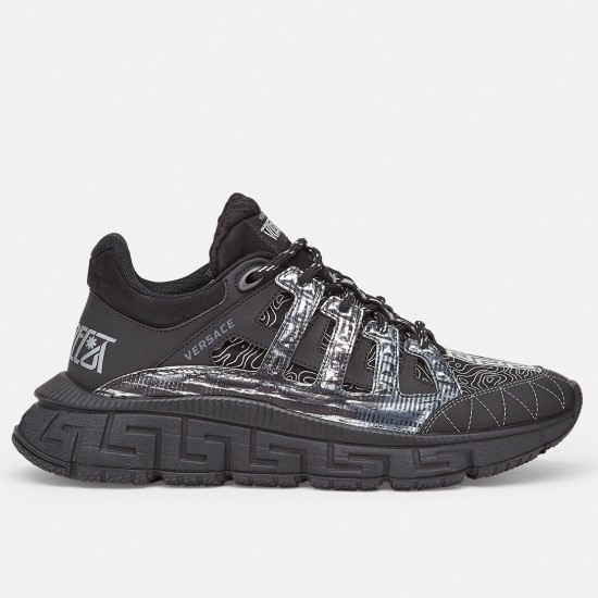 Versace Trigreca Black Trainer Side Profile Side profile of a single Versace Trigreca black trainer showing the Greca tread sole and patterned upper