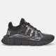 Versace Trigreca Black Trainer Side Profile Side profile of a single Versace Trigreca black trainer showing the Greca tread sole and patterned upper