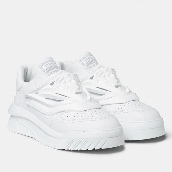 Pair of Versace Odissea white leather chunky low top trainers angled view