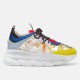 Versace Chain Reaction Baroque Print White Trainers Side View in white and yellow Profile view of Versace Chain Reaction Baroque Print White Trainers with chunky white sole and yellow toe cap