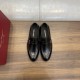 Ferragamo Men's Gancini Plaque Leather Loafers Black paired top view highlighting almond toe and apron stitching