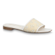 L Revival Flat Mules in white - Side View Side profile of L Revival Flat Mules in white showing the embroidered strap and low heel