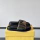 Fendi Diagonal Padded Slides In Brown - Box Display in brown and black Pair of Fendi brown and black slides resting on a yellow presentation box