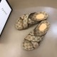 Gucci Cross Strap Monogram Slide Sandals Angled View in beige and brown Gucci cross strap monogram slide sandals angled arrangement in beige and brown