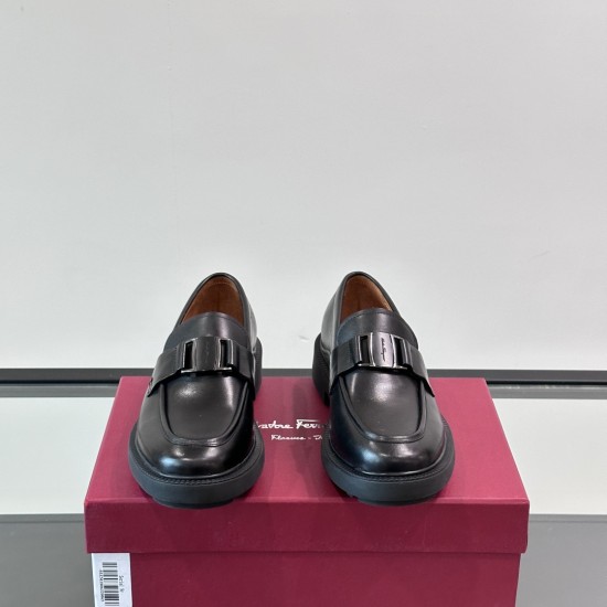 Front view of Ferragamo Men's Black Leather Chunky Sole Loafers displaying the apron toe and gunmetal vamp hardware.