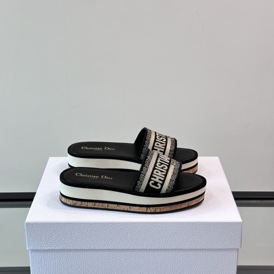 Dior Platform Slides Angled View in white and brown Angled side view of Dior Platform Slides in white and brown resting on a branded white box