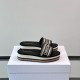 Dior Platform Slides Angled View in white and brown Angled side view of Dior Platform Slides in white and brown resting on a branded white box