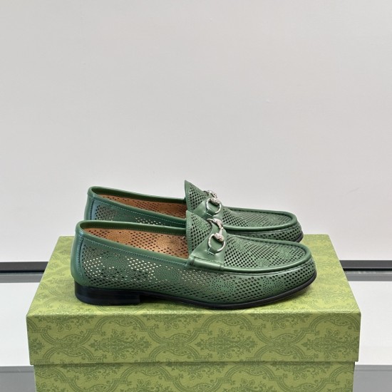 Men's Green Perforated Leather Horsebit 1953 Loafers Pair View in green and silver Pair of Men's Green Perforated Leather Horsebit 1953 Loafers shown resting on a green patterned shoe box in green and silver