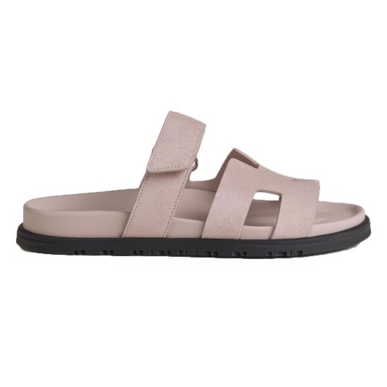 Hermes Chypre Sandals In Light Pink Side Profile Side profile view of Hermes Chypre Sandals In Light Pink showcasing the contoured footbed and dark rubber sole