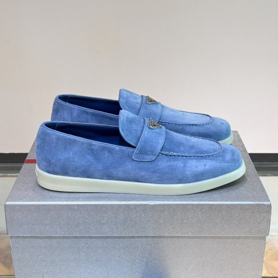 Pair of Prada Men's Blue Suede Loafers Soft Slip On Shoes positioned on grey box