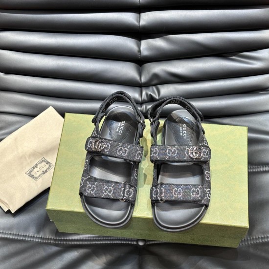 Direct overhead view of Gucci black and grey denim sandals highlighting the dual strap layout