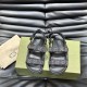 Direct overhead view of Gucci black and grey denim sandals highlighting the dual strap layout