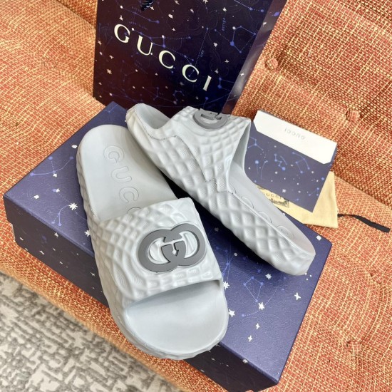 Gucci Slide Sandal Pair with Packaging in Grey Pair of grey Gucci slide sandals displayed on matching packaging boxes