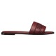 Side Profile View of Dior Dway Burgundy Grained Calfskin Slides Side profile view of the burgundy grained calfskin slides showing strap embroidery