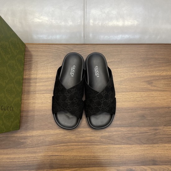Gucci Black Slide Sandals Overhead View Front overhead view of paired black suede slide sandals with brand footbed logos