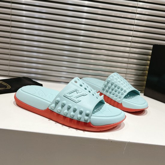 Christian Louboutin Blue and Red Mules Three-Quarter View Pair of Christian Louboutin blue and red mules displayed from a front three-quarter angle
