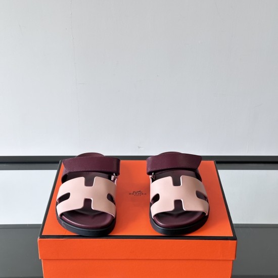 Hermes Chypre Sandals In Red And Beige Front View Front view of Hermes Chypre Sandals In Red And Beige highlighting the H-shaped strap design