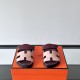 Hermes Chypre Sandals In Red And Beige Front View Front view of Hermes Chypre Sandals In Red And Beige highlighting the H-shaped strap design