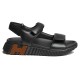 Hermes Black Leather Sandals Side Profile in black and white Side profile view of the black leather Hermes sandals on white background