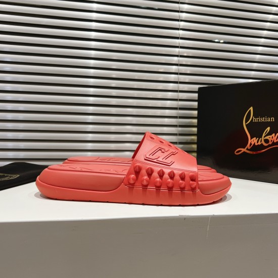 Side profile of stacked Christian Louboutin Take It Easy red mules next to a box